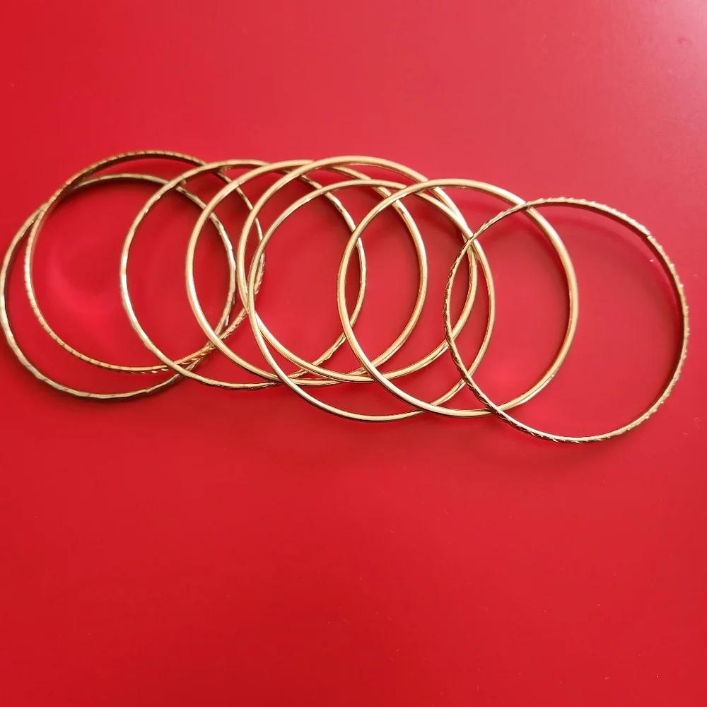 Designer Set of 9 Goldtone Bangle Bracelets